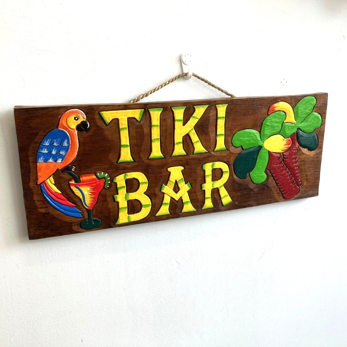 Wooden Tiki Bar Sign Hanging on the Wall
