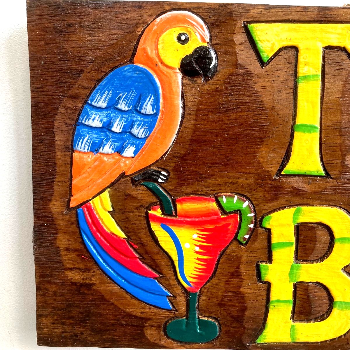 Parrot on Wooden Tiki Bar Sign
